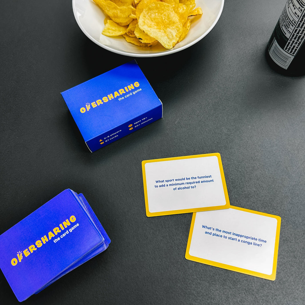 Tabletop game 'Oversharing' with cards and chips